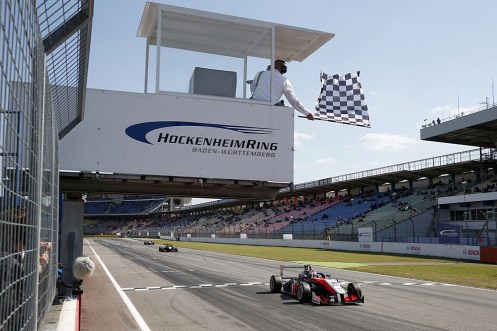 Verstappen takes the flag for his first F3 win. © FIA.